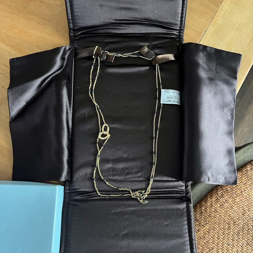 22” yellow gold necklace with black faceted stones